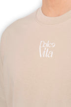 Détail du logo en relief à texture veloutée du t-shirt La Vita è Bella